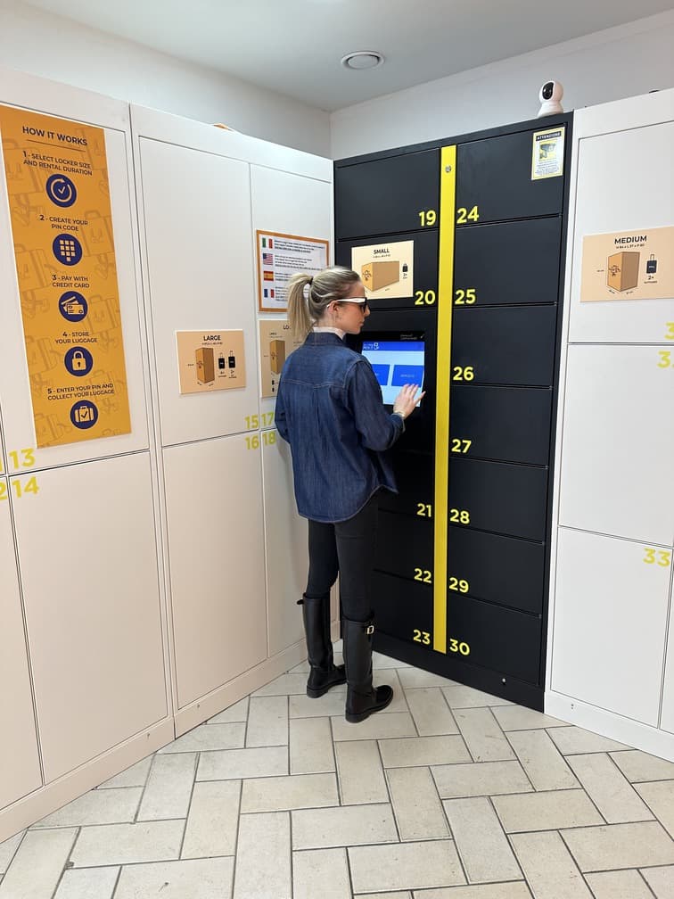 Open large locker showing suitcase storage capacity